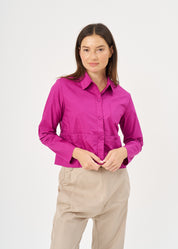 A button-up shirt is getting ready for a purple short