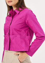 A button-up shirt is getting ready for a purple short