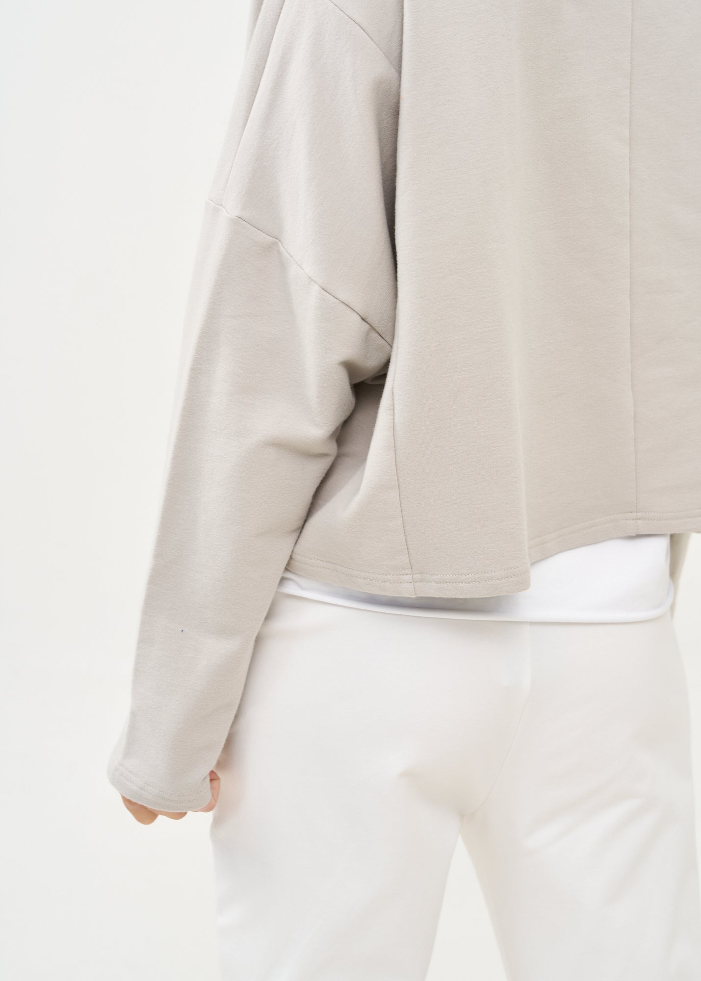 סווטשירט אסימטרי עם רוכסן אפור בהיר