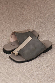 Comfort slippers in a combination of gray and washed leathers