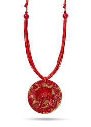 Handmade necklace made of threads and a large red resin circle