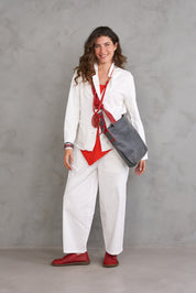 Handmade necklace made of threads and a large red resin circle