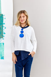 A chain of 3 resin circles on a blue thread