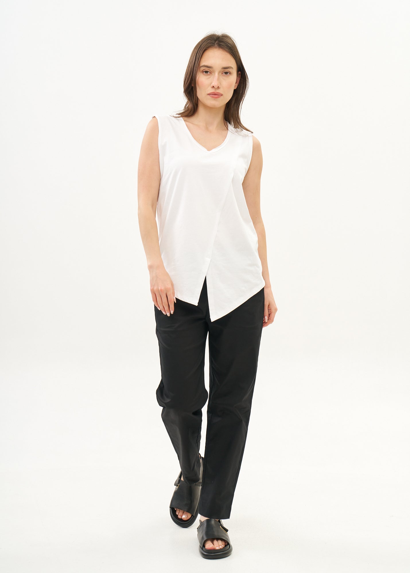 White V-neck tank top with diagonal stitching and slits