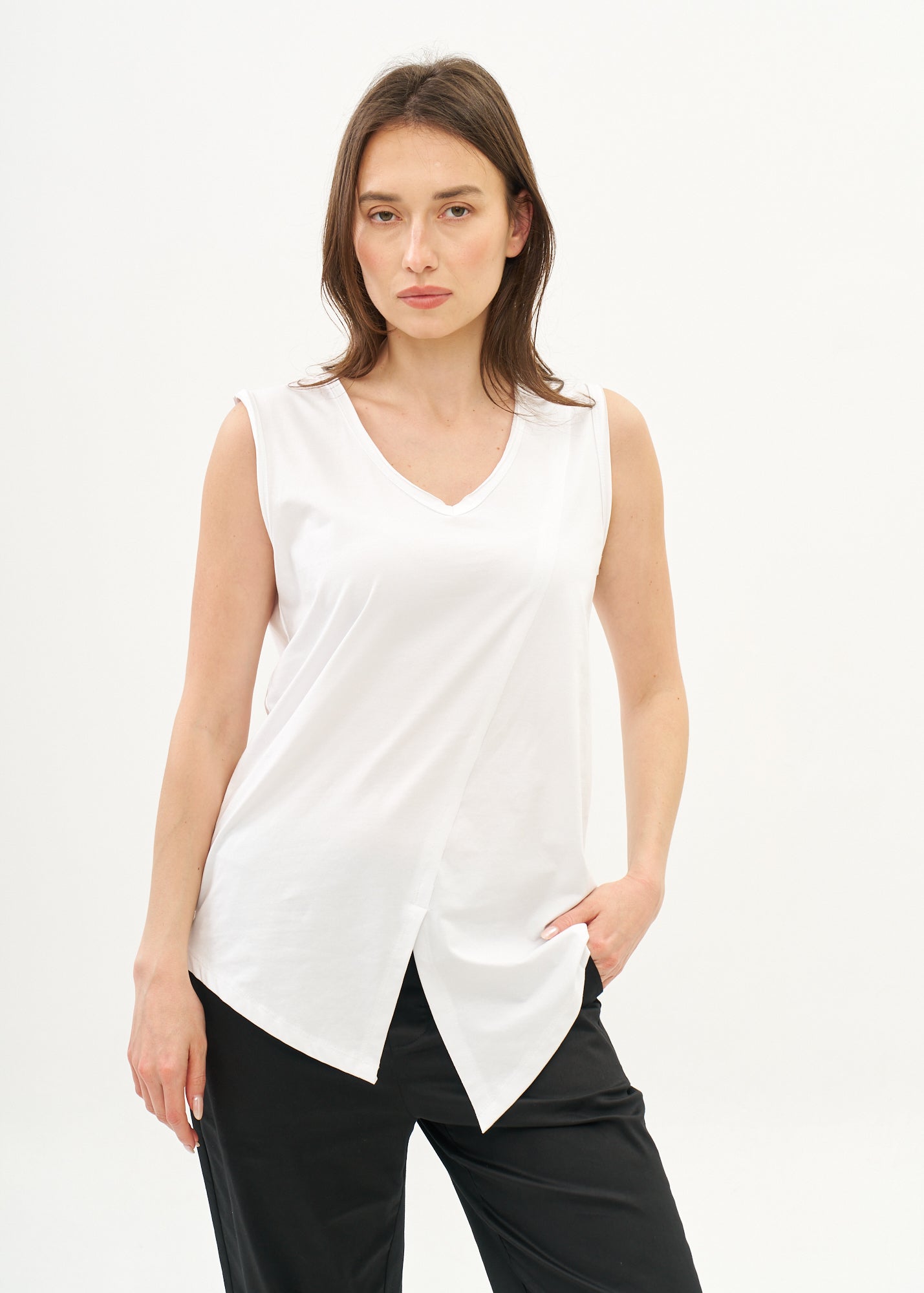 White V-neck tank top with diagonal stitching and slits