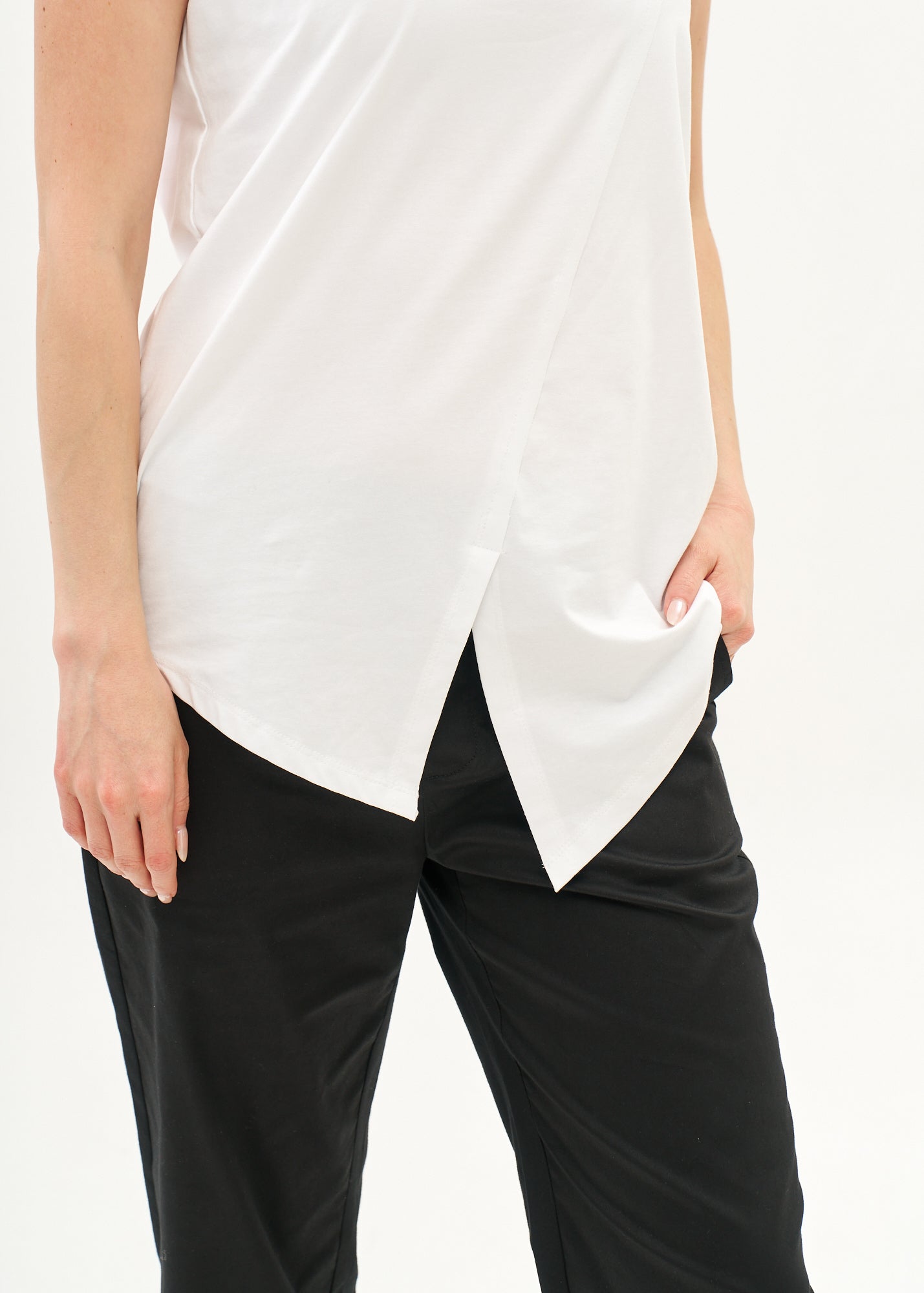 White V-neck tank top with diagonal stitching and slits