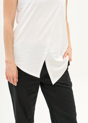 White V-neck tank top with diagonal stitching and slits