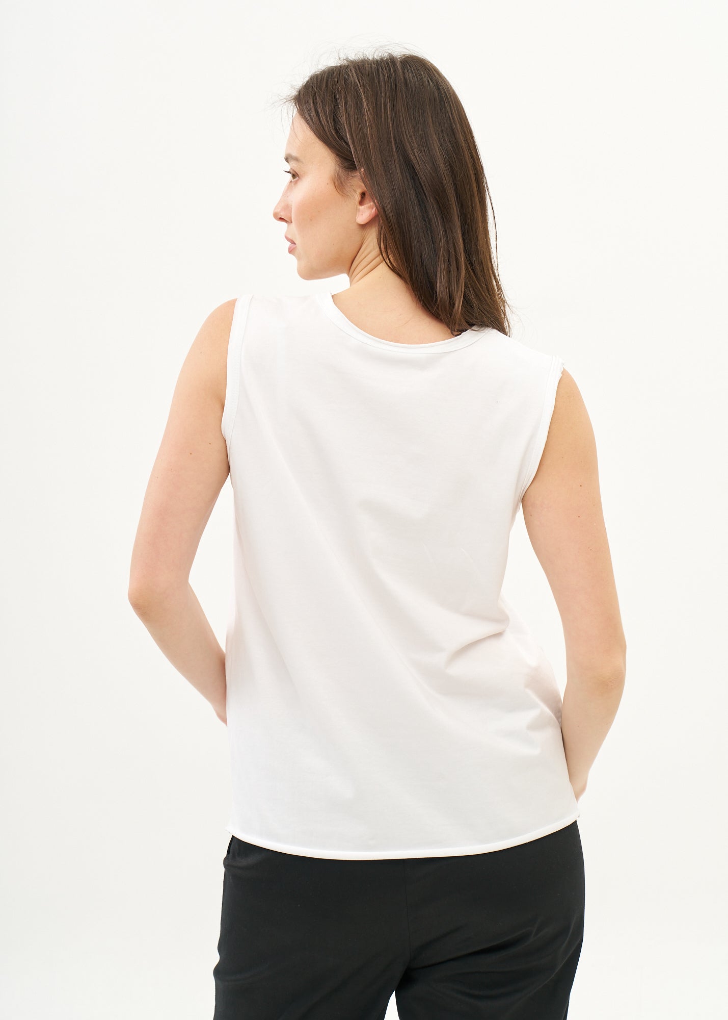 White V-neck tank top with diagonal stitching and slits
