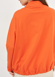 חולצה גולף אמצע שילוב הפוך כתום