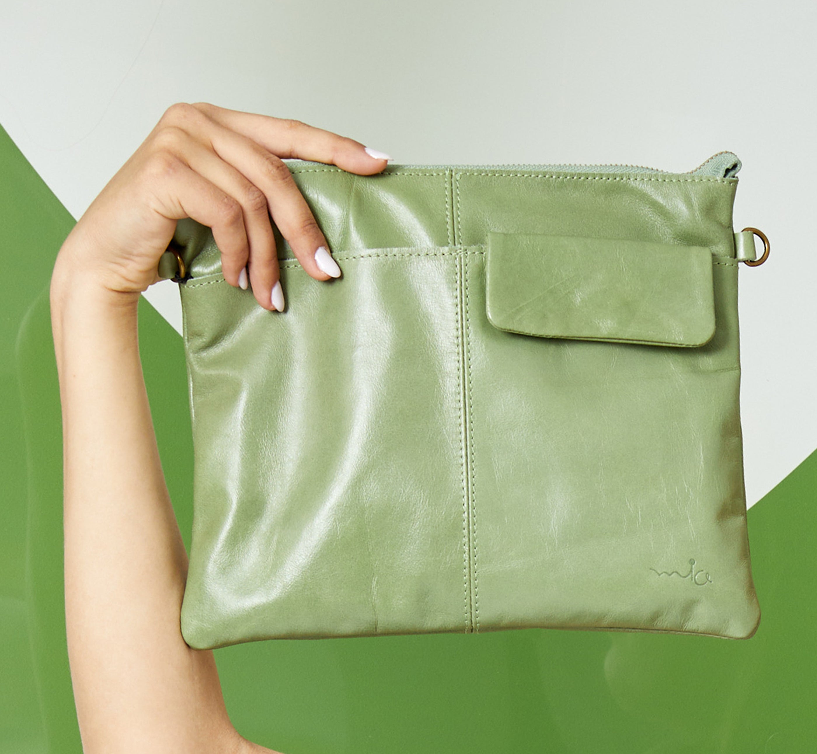 Leather evening bag with pocket and green flap
