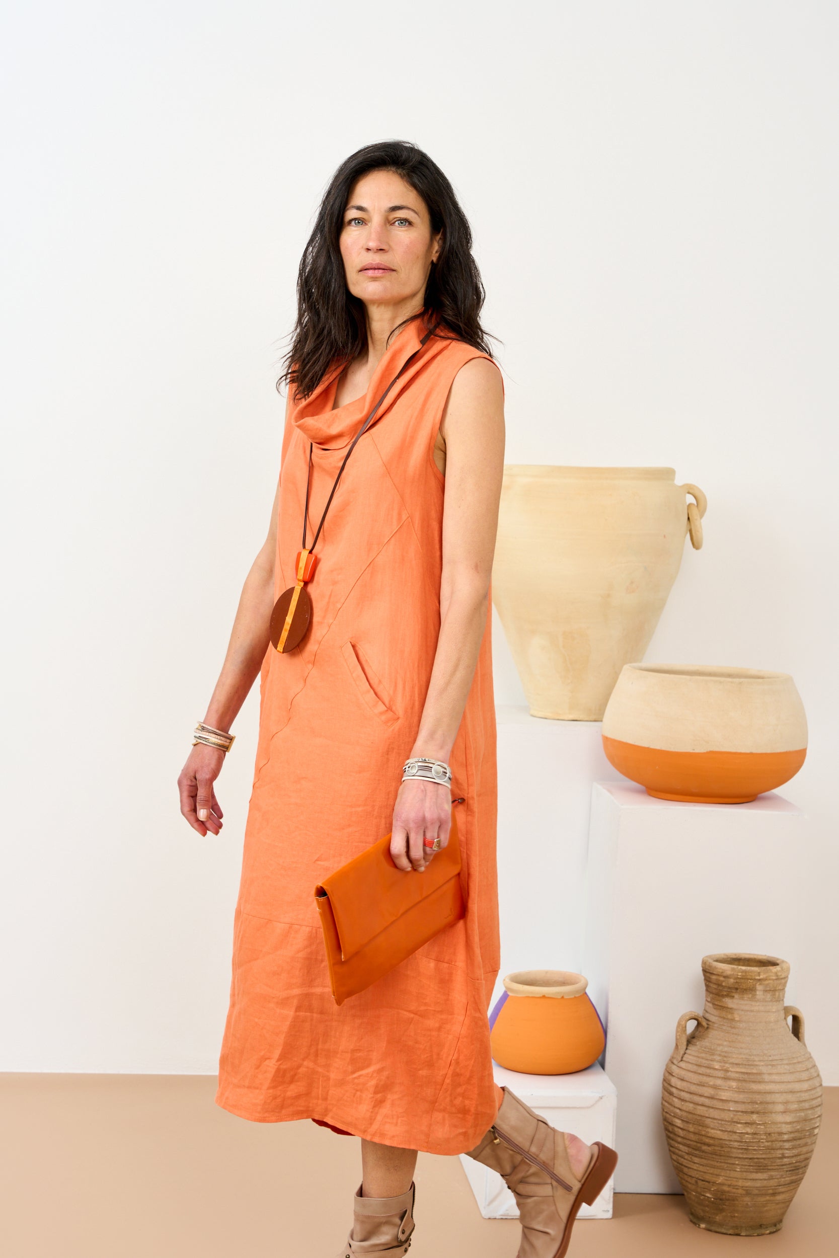 Leather evening bag with pocket and orange flap