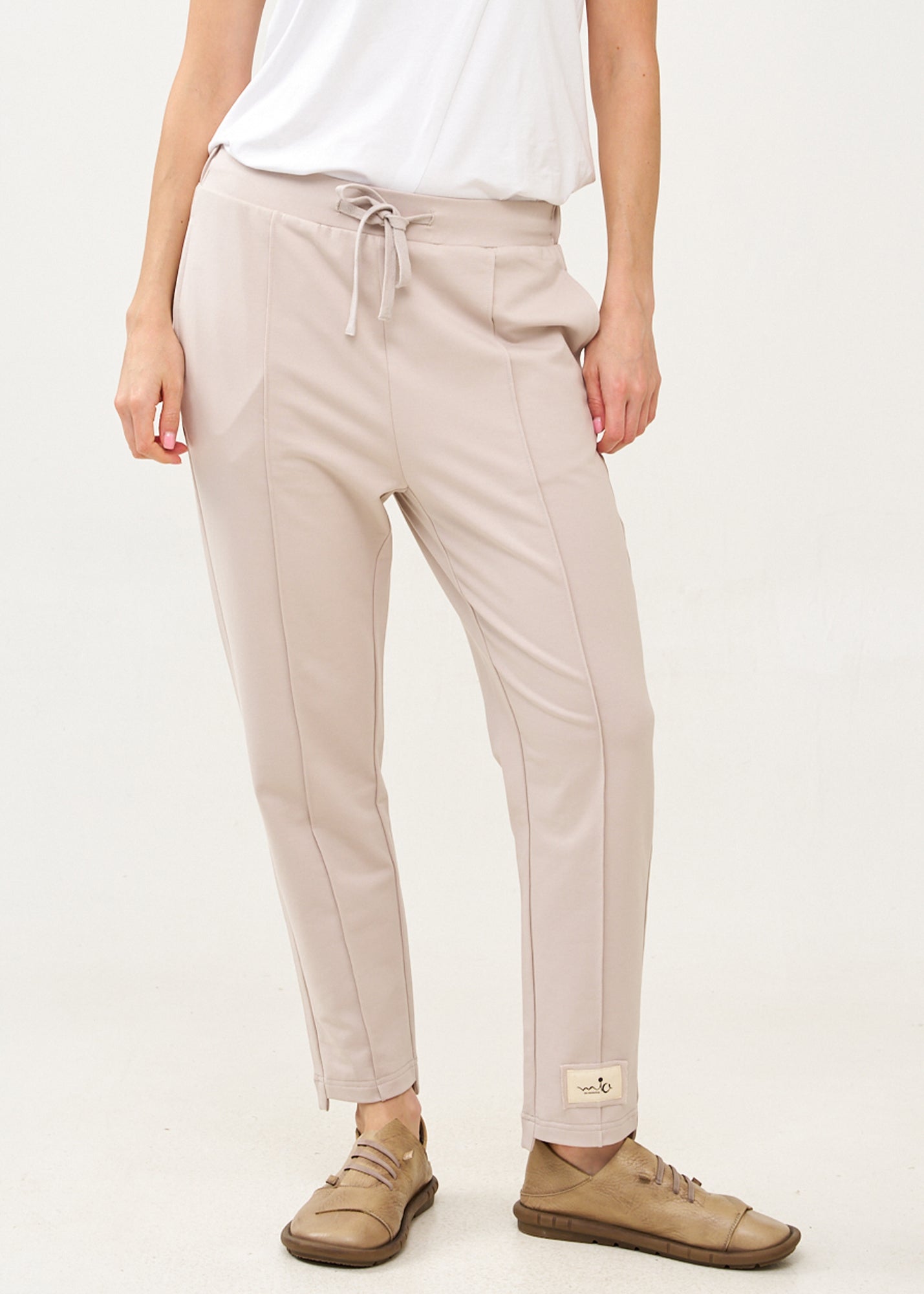 Pants with a seam in the middle and a stone patch