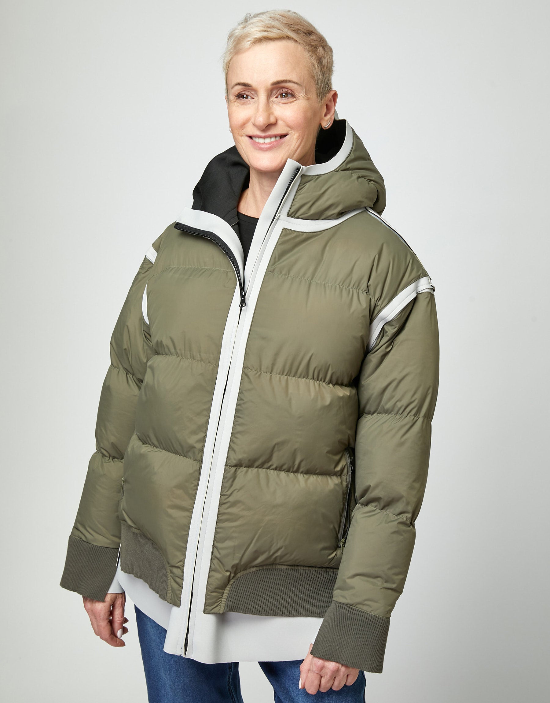 Puffy down jacket with a green hood