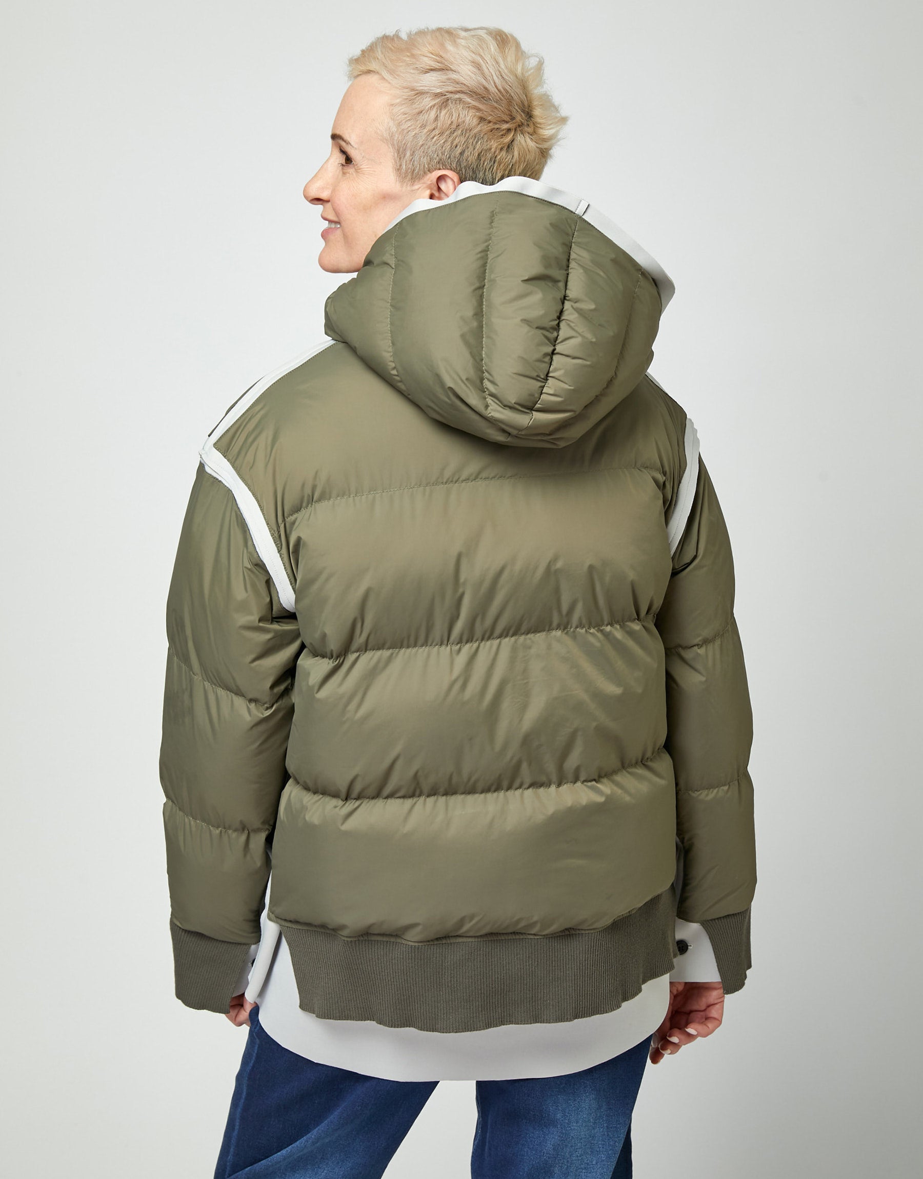 Puffy down jacket with a green hood