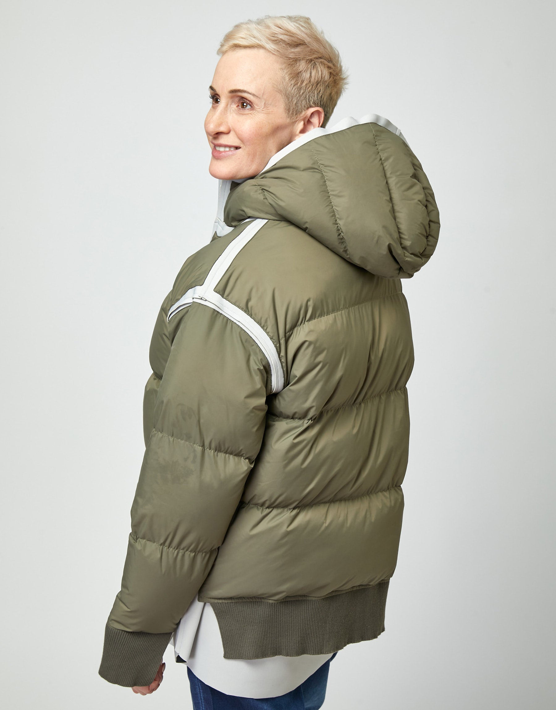 Puffy down jacket with a green hood