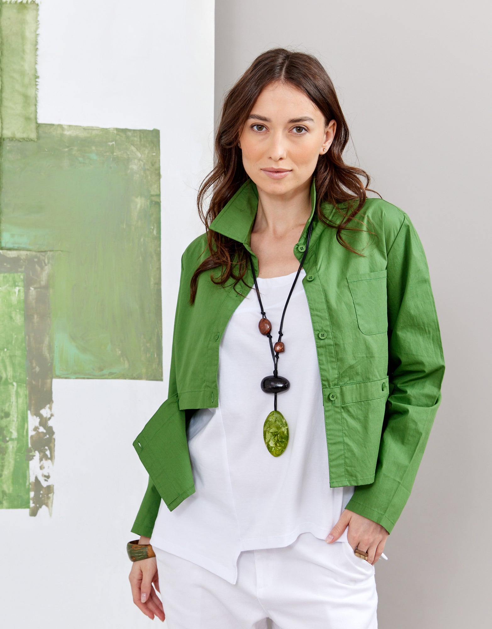 Handmade necklace combining green resin shapes