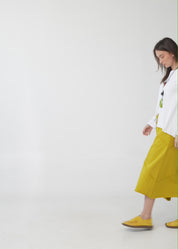 Asymmetrical skirt with reverse combination and mustard ribbons