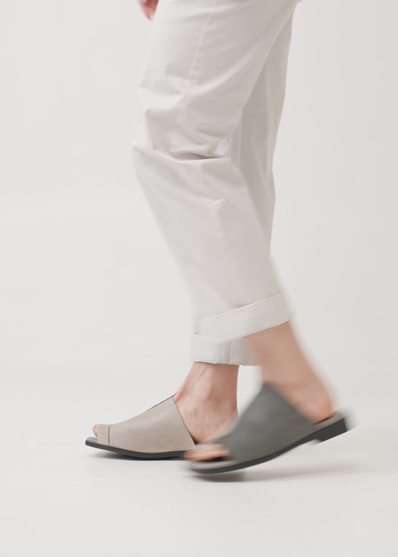 Comfort slippers in a combination of gray and washed leathers