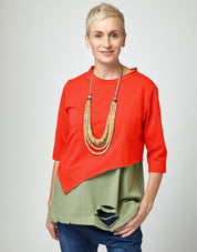 Short asymmetric red shirt
